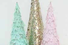 pink and green paper fringe Christmas trees and a gold sequin one will be a nice decor idea for styling a pastel Christmas space