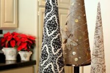 printed paper cone Christmas trees with tassels, coins, rhinestones, on metallic stands are nice for eclectic winter decor