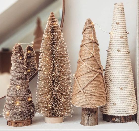rope, yarn and faux fur plus bottle brush Christmas trees decorated with beads and lights are an easy craft to repeat