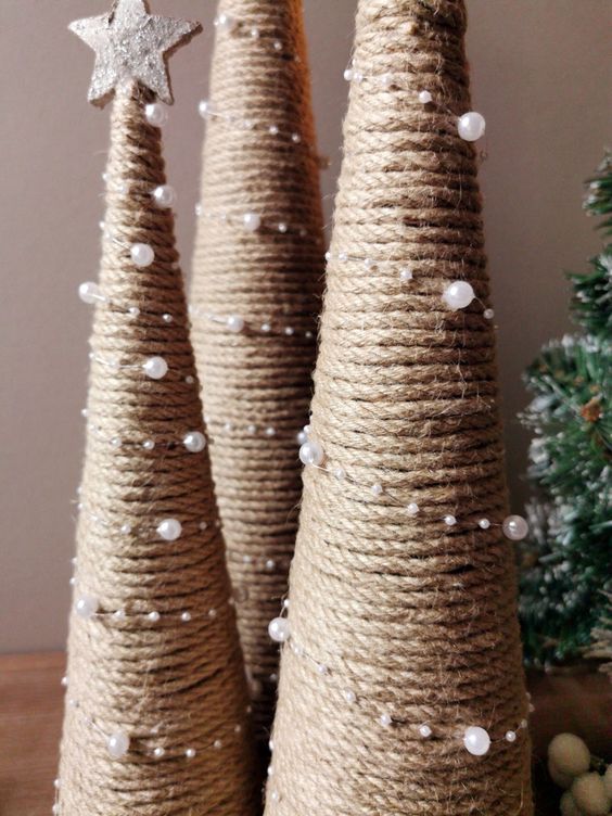 yarn cone shaped Christmas trees decorated with pearls and topped with silver stars will finish off your rustic holiday decor