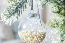05 a clear glass Christmas ornament filled with pearls is a glam and chic idea with a vintage feel