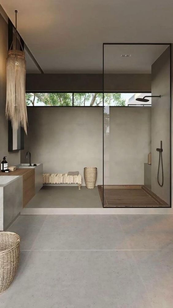 a large neutral Japandi bathroom clad with large scale tiles, with a large shower space and a clerestory window, a floating vanity