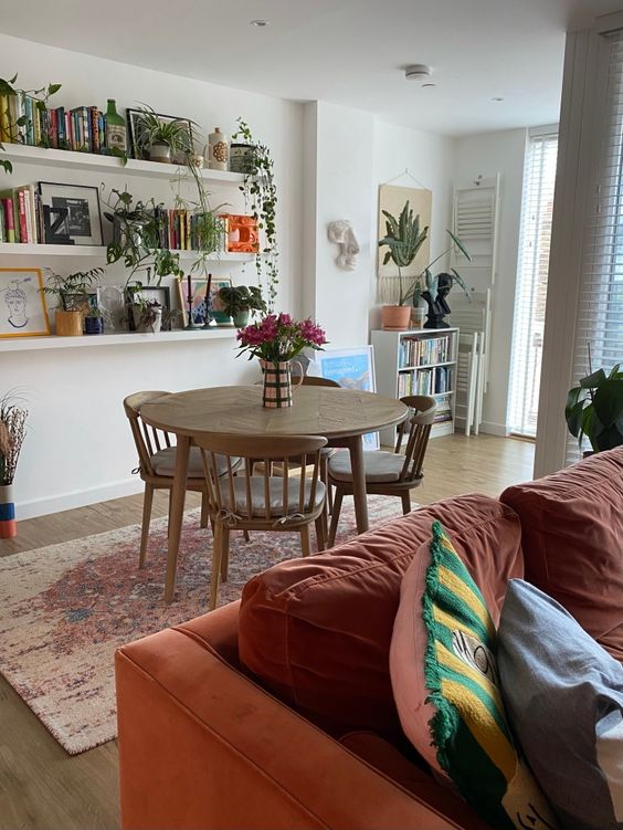 a welcoming open layout with bookshelves showing off favorite books, magazines, photos and artwork