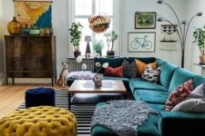 09 a colorful living room with an emerald sectional, mustard and navy poufs, a bold boho gallery wall and a map to personalize the space