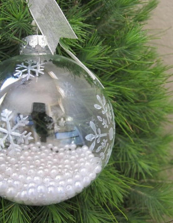 a clear snowflake ornament filled with pearls is a chic vintage-inspired Christmas decoration or addition to a Christmas gift
