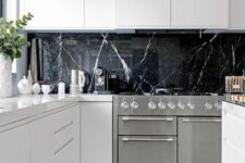 14 a black marble kitchen backsplash is a very luxurious touch to these ultra-minimalist white cabinets