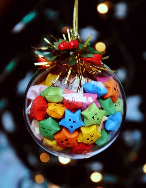 a fun Christmas ornament filled with colorful origami stars and topped with faux greenery and berries