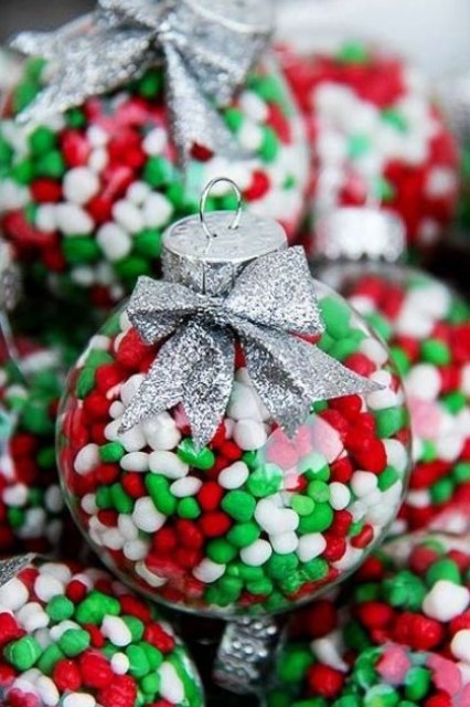Christmas-colored candies will be a great filling for a clear ornament, and they can be used not only as ornaments but also as favors