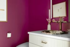19 a stylish bathroom with magenta walls, a neutral vanity and a mirror with a stone sink plus a white toilet