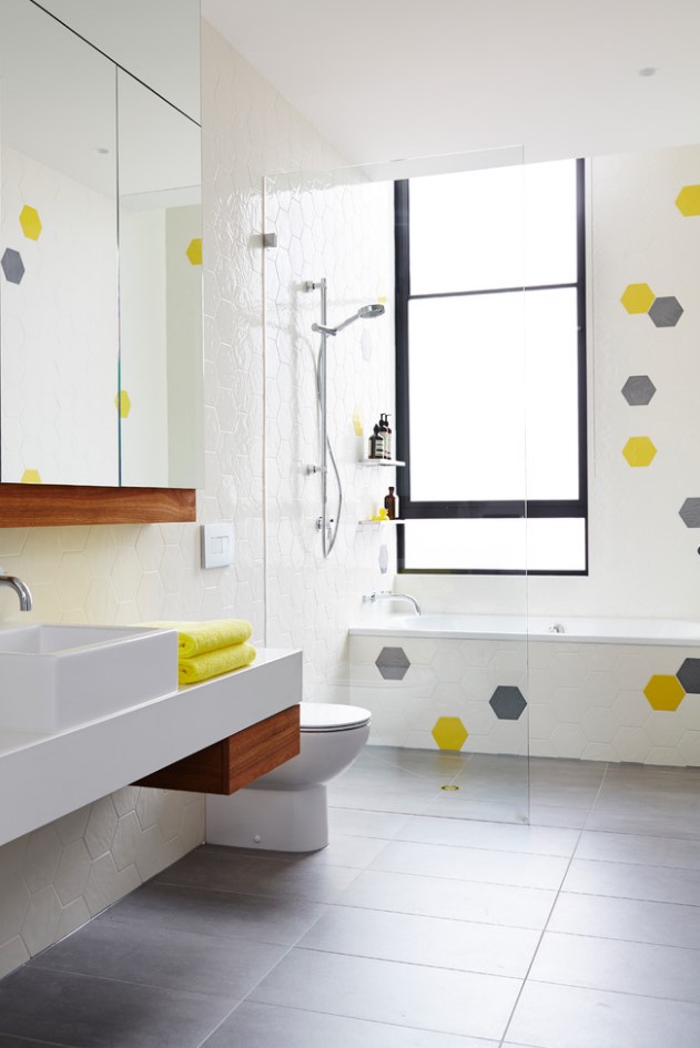plain white honeycomb tiles look especially great if you add several bold color splashes to them