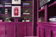 27 a home library done with magenta bookcases, pink stools and a printed rug just strikes with its bold color scheme