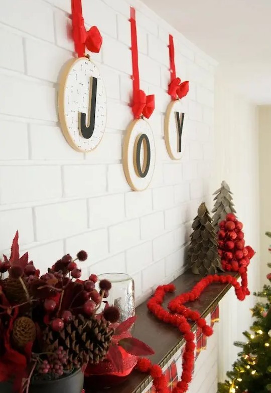 hoops with letters and red bows and ribbons are an amazing wall decoration for Christmas