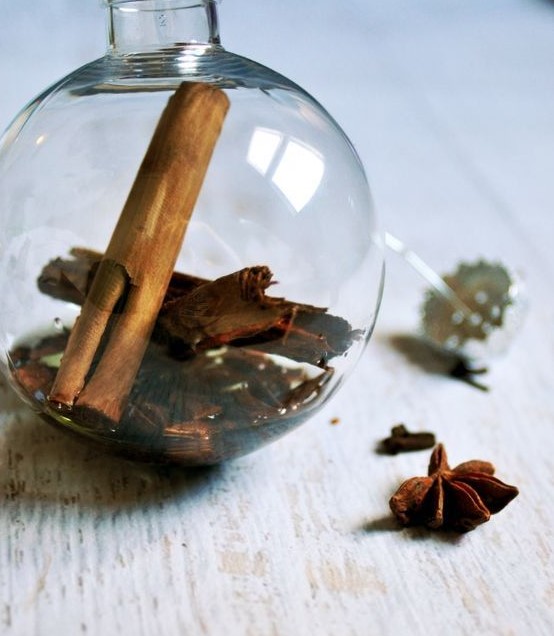 fill a glass Christmas ornament with whole spices, some grapeseed oil and essential oils orange, cinnamon for a perfect scent