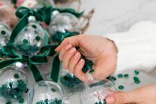 34 cool glam Christmas ornaments filled with emerald jewels and matching velvet ribbon bows are amazing for stylish decor