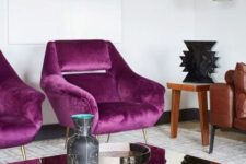 37 a refined living room with magenta chairs for an accent, a leather sofa and a mirror coffee table plus a pendant lamp