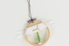 38 an embroidery hoop Christmas ornament with a bottle brush tree, a ribbon with a word is easy to recreate