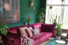 a lovely living room with a green accent wall