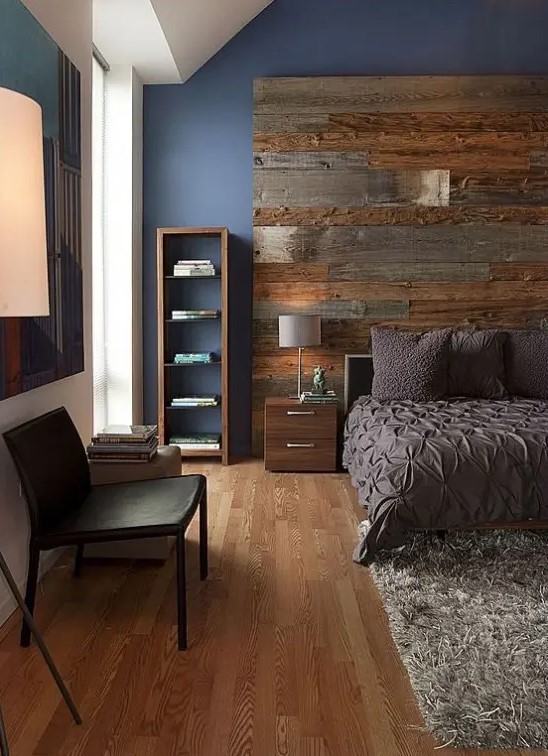 an accent weathered and aged wood wall makes a contemproary bedroom more rustic and adds coziness