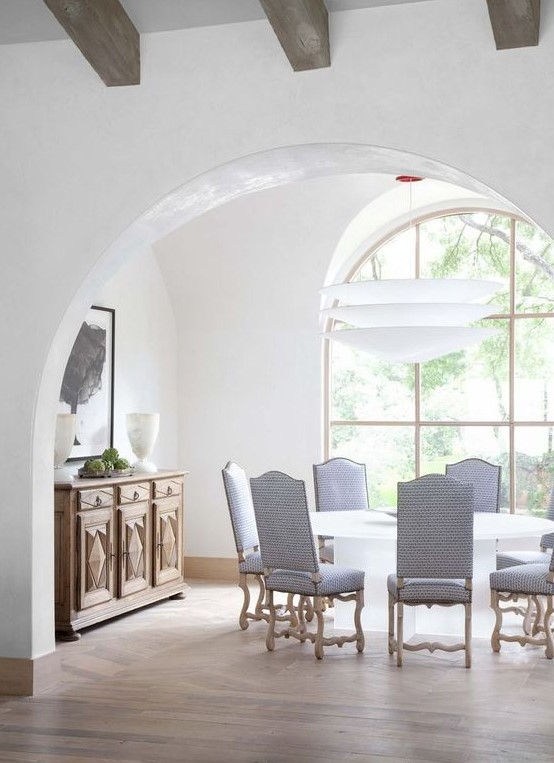 an arched doorway and a matching window make the dining room more formal, stylish and refined