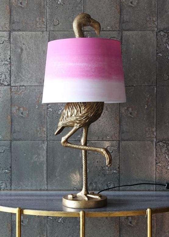 an antique bronze flamingo table lamp with a tie-dye pink lampshade for a touch of color to the space