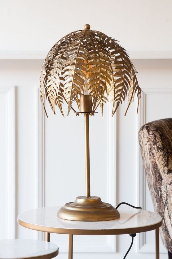 a gold fern leaf table lamp will bring a refined touch to the space and make it very sophisticated