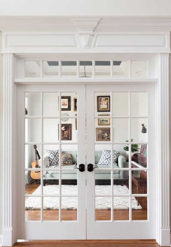 French doors with a transom window are an elegant solution to let more natural light inside and add chic to the space