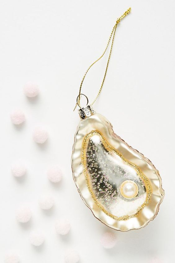 a beautiful oyster with a pearl Christmas ornament is a very refined and delicate decoration for your Christmas tree