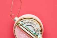 a can with pink caviar is a lovely Christmas ornament with a refined and chic touch