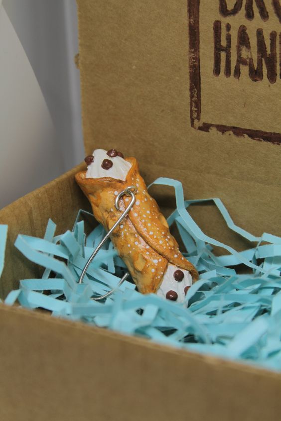 a cannoli Christmas ornament is a creative idea and will be a nice solution for those who have a sweet tooth