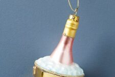 a champagne bucket ornament is a lovely idea for NYE parties, it’s a lovely idea for stylign a glam Christmas tree