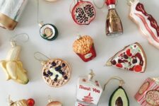 a collection of gorgeous foodie Christmas ornaments including pizza, waffles, a banana, a donut, ice cream, soy sauce and much other stuff