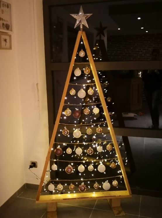 a frame Christmas tree with lights and white and brown ornaments plus a star topper is a cool idea for winter holidays