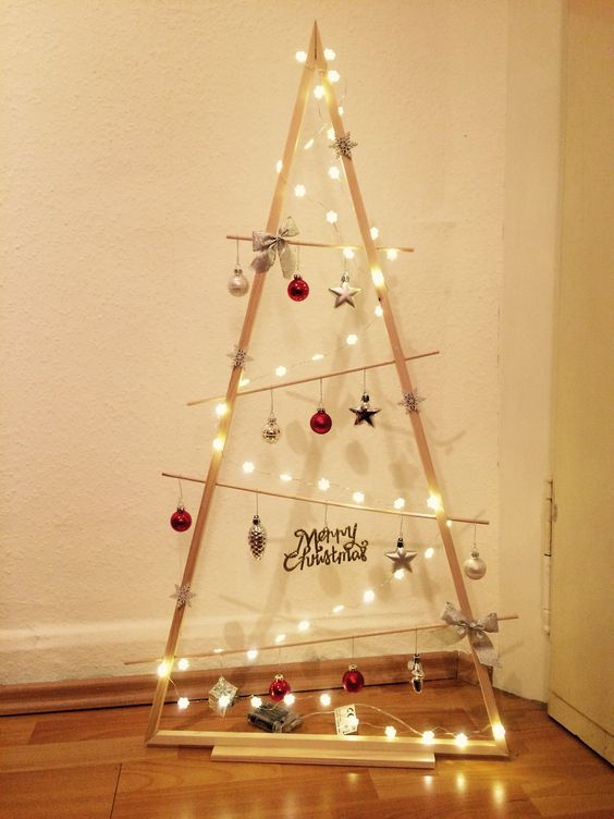 a frame Christmas tree with lights, various ornaments, bows and calligraphy is a cool idea for the holidays