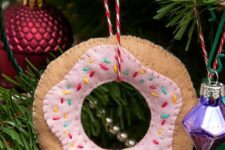 a glazed donut Christmas ornament of felt can be easily DIYed to add a bit of fun and a cool touch to your tree