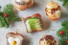 a gorgeous breakfast-inspired Christmas ornament collection including an avocado toast, a cappuccino, a fried egg toast, pancakes and honey