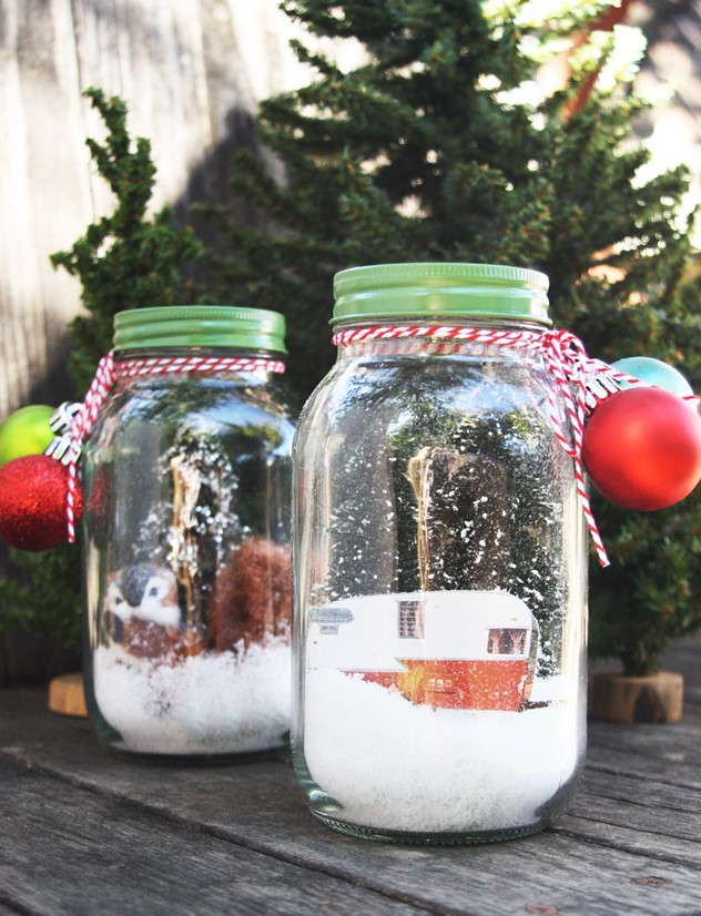 a jars with faux snow, a vintage van, some faux birds and Christmas ornaments are very pretty holiday terrariums
