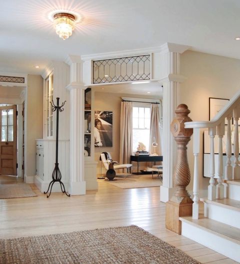 a large vintage entryway and an opening with a chic and stylish transom window with a decorative touch is gorgeous