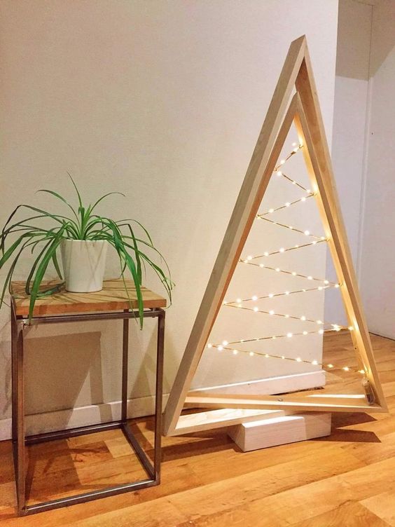 a minimalist double frame Christmas tree with lights inside and on a stand is a lovely and bold idea to rock