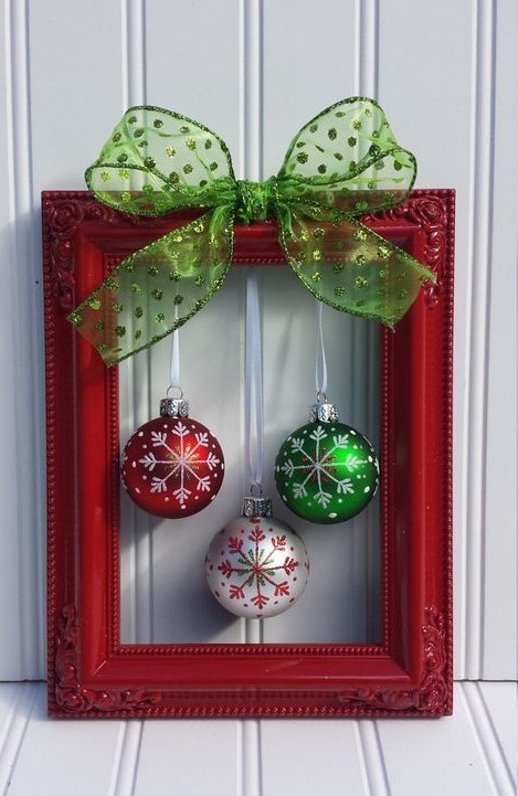 a simple and lovely frame Christmas wreath of a red frame, a red, green and white ornament and a polka dot green bow on top