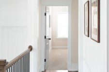 a small transom window adds more light to the corridor and makes the space feel a bit more vintage than modern