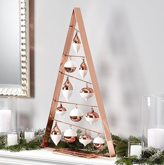 a tabletop copper frame Christmas tree with white and copper ornaments is great for mantels and tables