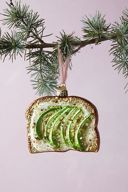 a unique Christmas ornament showing off an avocado toast with salt is a fantastic idea for styling a tree