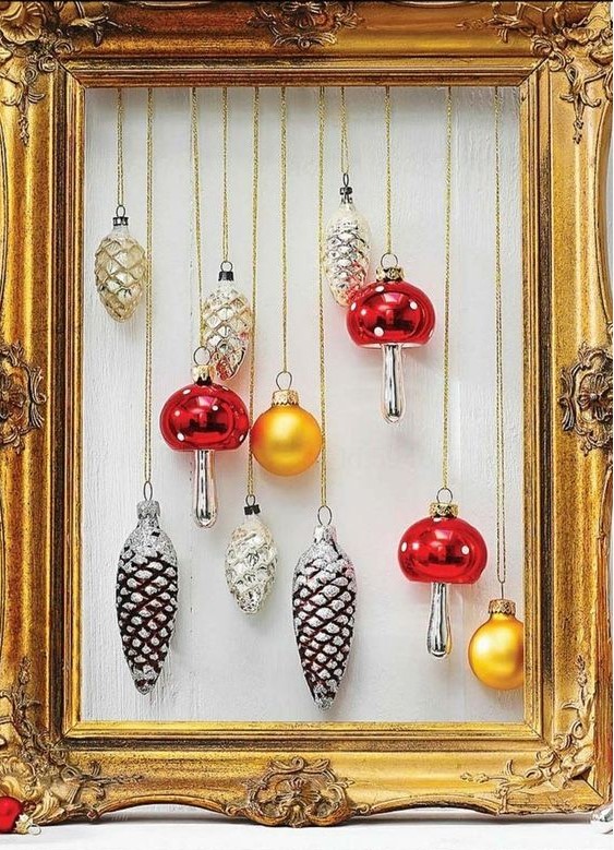a vintage gold frame Christmas wreath with mushroom, pinecone and usual gold ornaments looks fantastic and very chic