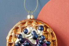 a waffle with cream and blueberries is a very unexpected solution for a Christmas tree, but who wants it boring anyway