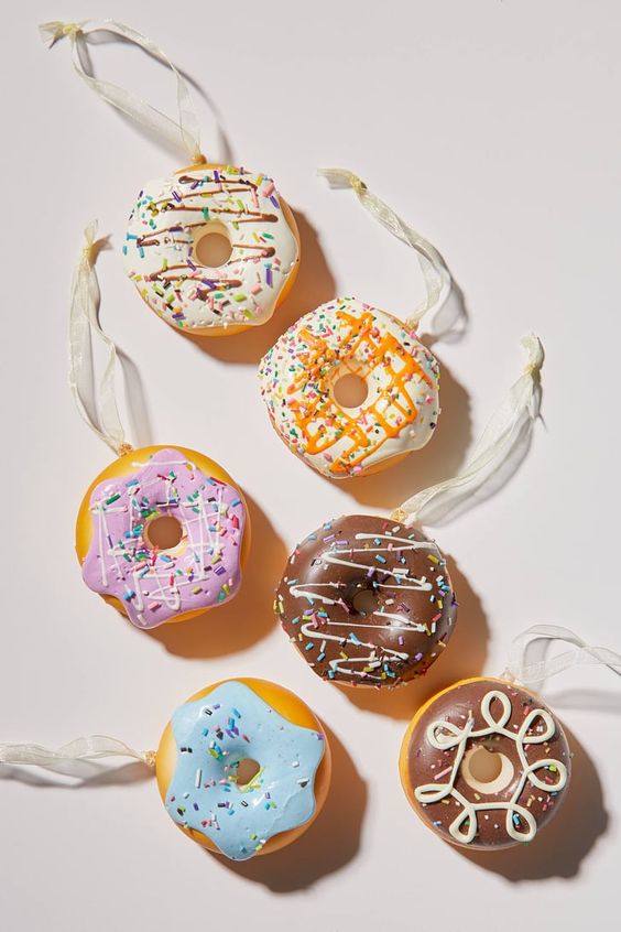 an arrangement of glazed donuts is a fantastic Christmas tree decor idea to rock, they look delicious