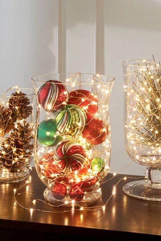 glass bowls with pinecones, evergreens and bold Christmas ornaments and lights are amazing to style your space for the holidays