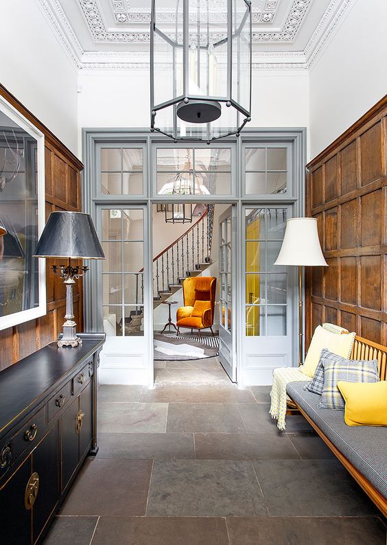 grey French doors paired with a matching transom window are a chic and stylish combo for an elegant space