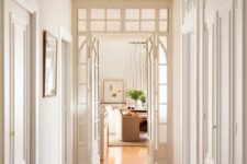 white French doors paired with a transom window are a great way to fill the corridor with natural light and make it cooler