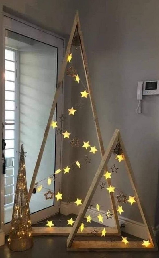 wood frame Christmas tree with star ornaments and star lights are a very simple and very cute idea of holiday decor