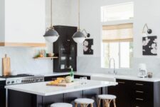 03 a black and white kitchen with black cabinets, white walls, countertops and a backsplash and a matching black and white kitchen island
